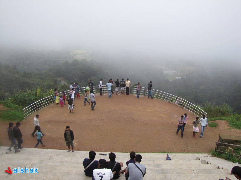 Visitors enjoying the view from Raja's Seat, Madikeri