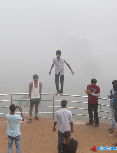 Dangerous Youth, standing on the railing balcony at Raja's Seat, Madikeri