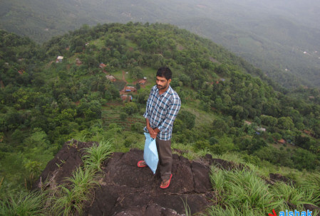 Mohanan Master at the Peak of Palakkayam Thattu, Kottayam Thattu in the background